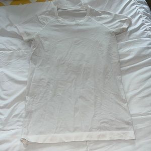 White swiftly tee